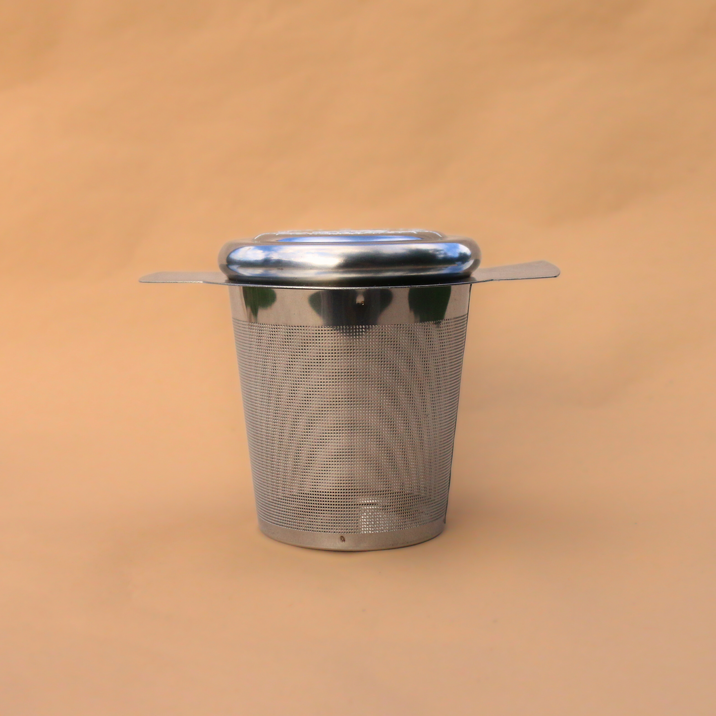 Flora & June's stainless steal tea infuser in silver.