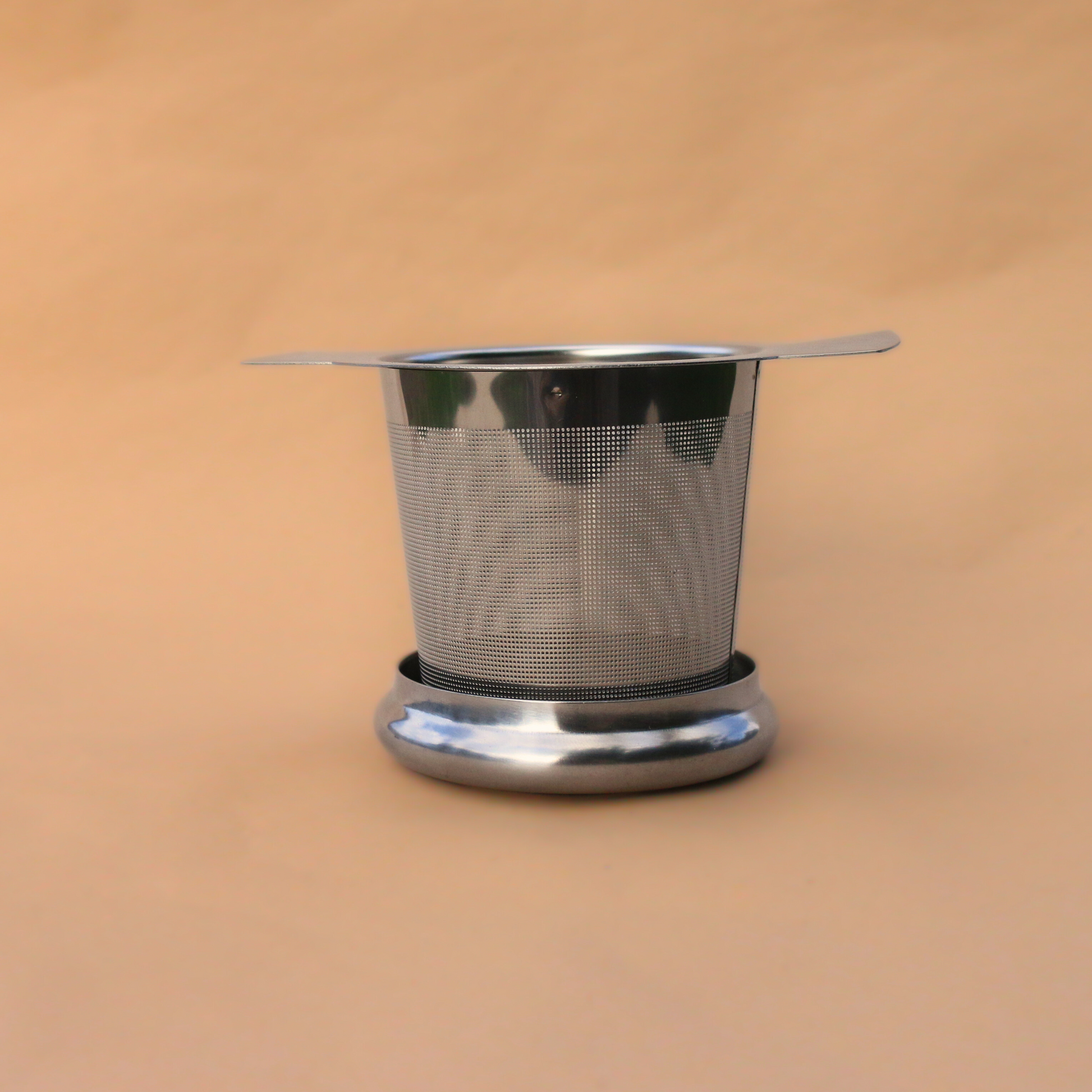 Flora & June's stainless steal tea infuser in silver.